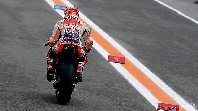 marquez defies injury to qualify fifth for valencia motogp