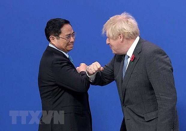 PM Pham Minh Chinh and British Prime Minister Boris Johnson. (Photo: VNA)