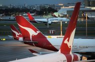 Qantas planes on the tarmac at Sydney International Airport. Australian flag carrier Qantas said Friday customers will be able to access the Internet inflight on certain services from February using their personal electronic devices