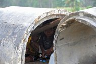 Tens of thousands of flash flood survivors in the Philippines face life in tent cities for months while safe areas to resettle them are sought, top relief officials said Monday