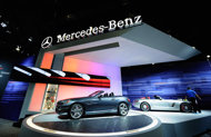 A car detailer wipes a Mercedes-Benz car on display at the Los Angeles Auto Show in November 2011. In a first, two German manufacturers -- Mercedes-Benz and BMW -- are dueling for the honor of being the top luxury brand sold in the United States.