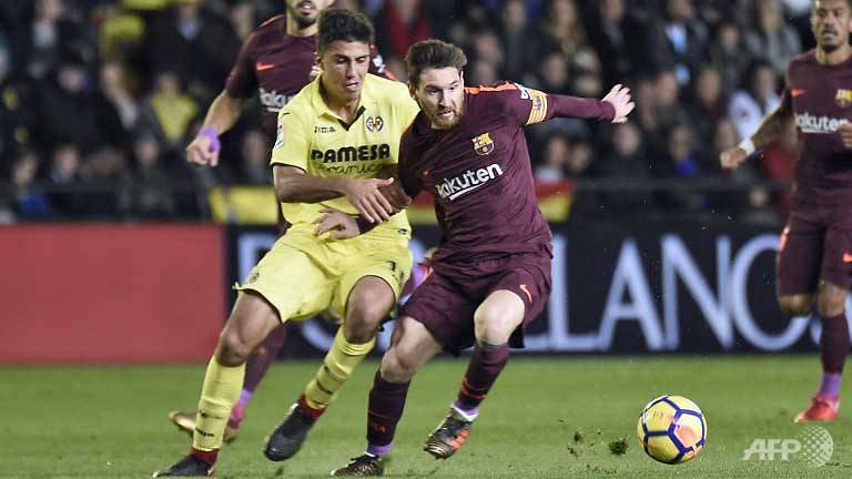 Suarez, Messi maintain Barca's La Liga lead