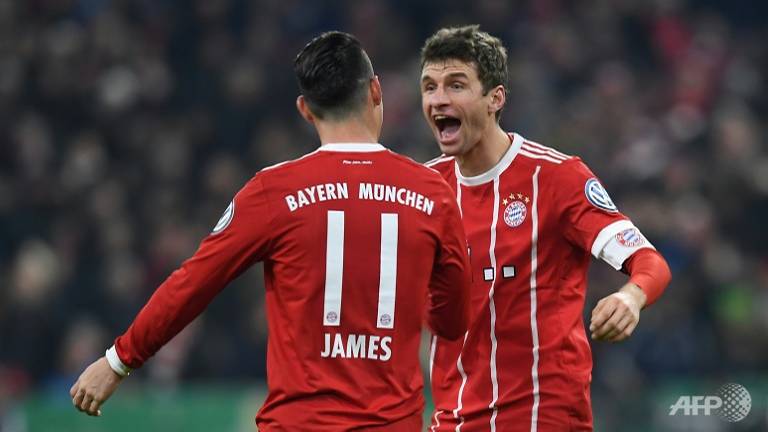 mueller helps bayern battle past dortmund