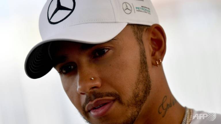 F1 champion Hamilton sorry for criticising dress-wearing nephew