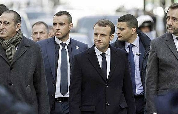 Macron surveys damage after Paris riots, calls for talks
