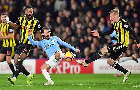 Man City withstand late Watford onslaught to move five points clear