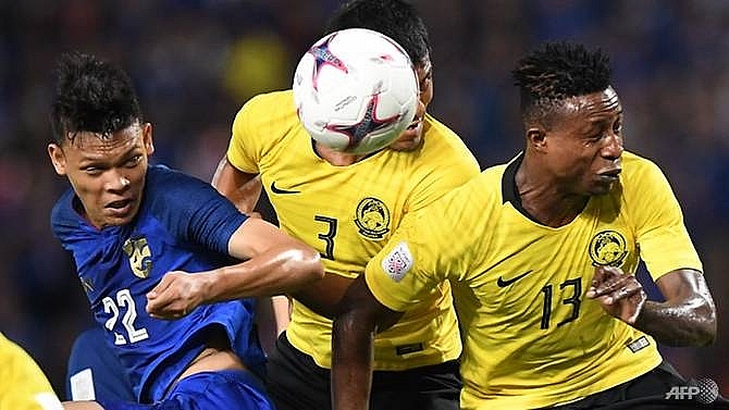 malaysia into suzuki cup final after nailbiting draw