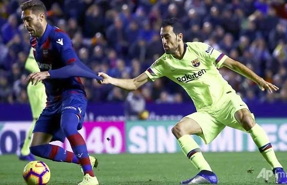 Messi hat-trick restores Barcelona's La Liga lead