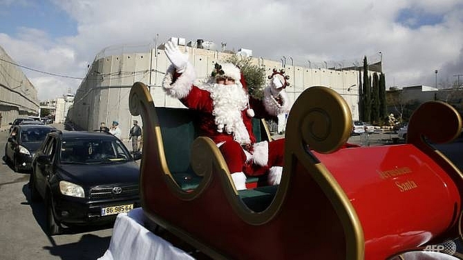 pilgrims gather in bethlehem to celebrate christmas eve