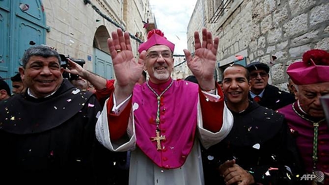 pilgrims gather in bethlehem to celebrate christmas eve