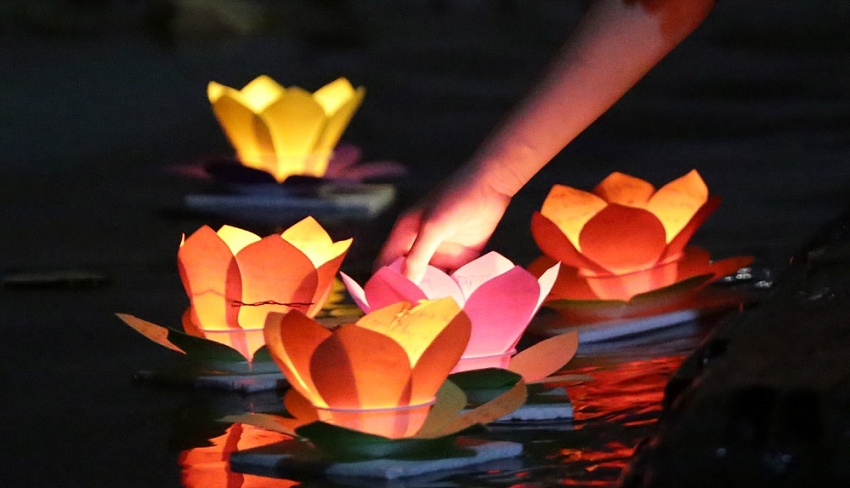 lanterns shine on saigon river full moon festival